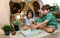 Children camping at home playing fishing game