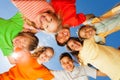 Happy children close in circle on sky background Royalty Free Stock Photo
