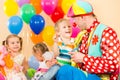 Happy children and clown on birthday party Royalty Free Stock Photo