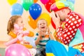 Happy children and clown on birthday party Royalty Free Stock Photo