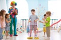 Happy children and clown on birthday party Royalty Free Stock Photo