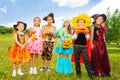 Happy children in colorful Halloween costumes Royalty Free Stock Photo