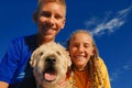 Happy children with dog Royalty Free Stock Photo