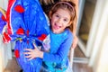 happy children easter egg background - little girl smiles embracing big easter egg Royalty Free Stock Photo