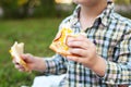 Happy children eating pizza outdoors Royalty Free Stock Photo