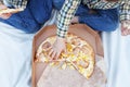 Happy children eating pizza outdoors Royalty Free Stock Photo