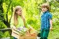 Happy children farmers working with spud on spring field. Active children concept. Nature and children lifestyle Royalty Free Stock Photo