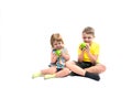 Happy children with fruits. Boy and baby girl eat green apples. isolated on a white background. Healthy food concept, fresh Royalty Free Stock Photo