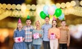 Happy children with gifts at birthday party Royalty Free Stock Photo