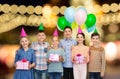 Happy children with gifts at birthday party Royalty Free Stock Photo