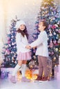 Happy children girl and boy waiting for Christmas, winter holidays Royalty Free Stock Photo