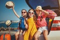 Happy children girls friends sisters on the car ride to summer trip Royalty Free Stock Photo