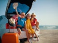 Happy children girls friends sisters on the car ride to summer trip Royalty Free Stock Photo