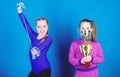 Happy children with gold champion cup. victory of teen girls. Winners in competition. Acrobatics and gymnastics. Little