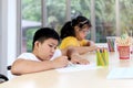 Happy children have fun with friends during study at school, boy sitting in wheelchair, painting on paper in art classroom, Royalty Free Stock Photo