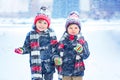 Happy children having fun with snow in winter Royalty Free Stock Photo