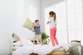 Happy children having pillow fight Royalty Free Stock Photo