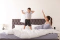 Happy children having pillow fight Royalty Free Stock Photo