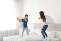 Happy children having pillow fight Royalty Free Stock Photo