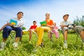 Happy children hold exercise books and sit Royalty Free Stock Photo