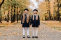 Happy children holding hands in a beautiful autumn park Royalty Free Stock Photo