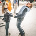 Happy children ice skating at rink outdoor Royalty Free Stock Photo