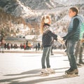 Happy children ice skating at rink outdoor Royalty Free Stock Photo