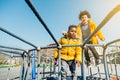 Happy children jumping on elastic bed outdoors Royalty Free Stock Photo