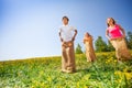 Happy children jumping in sacks during play Royalty Free Stock Photo