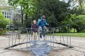 Happy children jumping on a trampoline or elastic bed Royalty Free Stock Photo