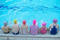 Happy children kids group at swimming pool class learning to swim Royalty Free Stock Photo