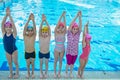 Happy children kids group at swimming pool class learning to swim Royalty Free Stock Photo