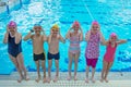 Happy children kids group at swimming pool class learning to swim Royalty Free Stock Photo