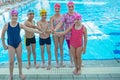 Happy children kids group at swimming pool class learning to swim Royalty Free Stock Photo