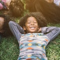 Happy children kids laying on grass