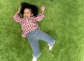 Happy children kids smiling and laying on green carpet floor in living room at home. Royalty Free Stock Photo