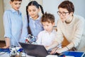 Happy children learn programming using laptops on extracurricular classes Royalty Free Stock Photo