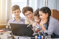 Happy children learn programming using laptops on extracurricular classes Royalty Free Stock Photo