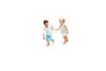 Happy children, little caucasian boy and girl jumping and running isolated on white background Royalty Free Stock Photo