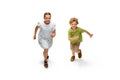Happy little caucasian girl and boy jumping and running isolated on white background Royalty Free Stock Photo