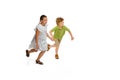 Happy little caucasian girl and boy jumping and running isolated on white background Royalty Free Stock Photo