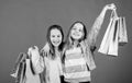 Happy children. Little girl sisters enjoying online shopping. Small girls with shopping bags. Sales and discounts Royalty Free Stock Photo