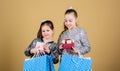 Happy children. Little girl sisters with gift box. Sales and discounts. Sisterhood and family. savings on purchases. Kid Royalty Free Stock Photo