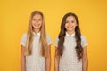 Happy children with long hair. fashion and beauty. childhood happiness. healthy hair. small girl in school uniform Royalty Free Stock Photo
