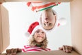 Surprised children unpack Christmas gift box Royalty Free Stock Photo