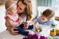 Happy children with mother eating cupcakes Royalty Free Stock Photo