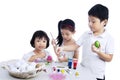 Happy children painting easter eggs Royalty Free Stock Photo