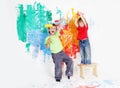 Happy children painting wall with colours Royalty Free Stock Photo