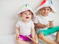 Happy children painting wall at home Royalty Free Stock Photo