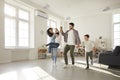 Happy children and parents having fun in the living-room of their new house or apartment Royalty Free Stock Photo